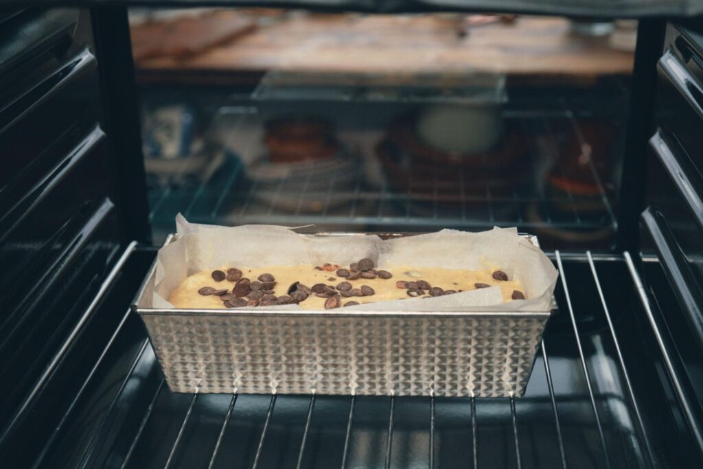 Banana bread baking in oven following recipe for banana bread